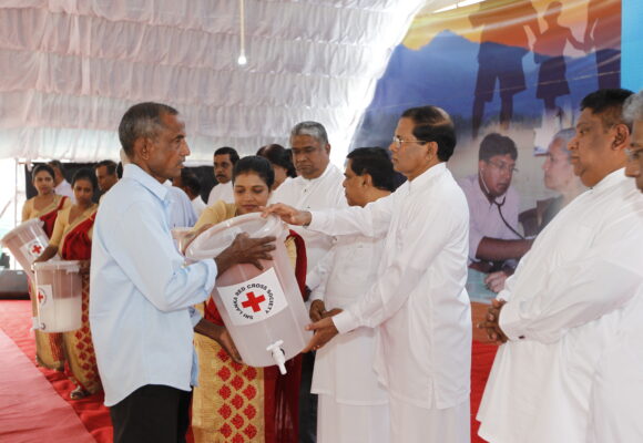 Distribution of Red Cross clay water filters to the public to combat kidney disease